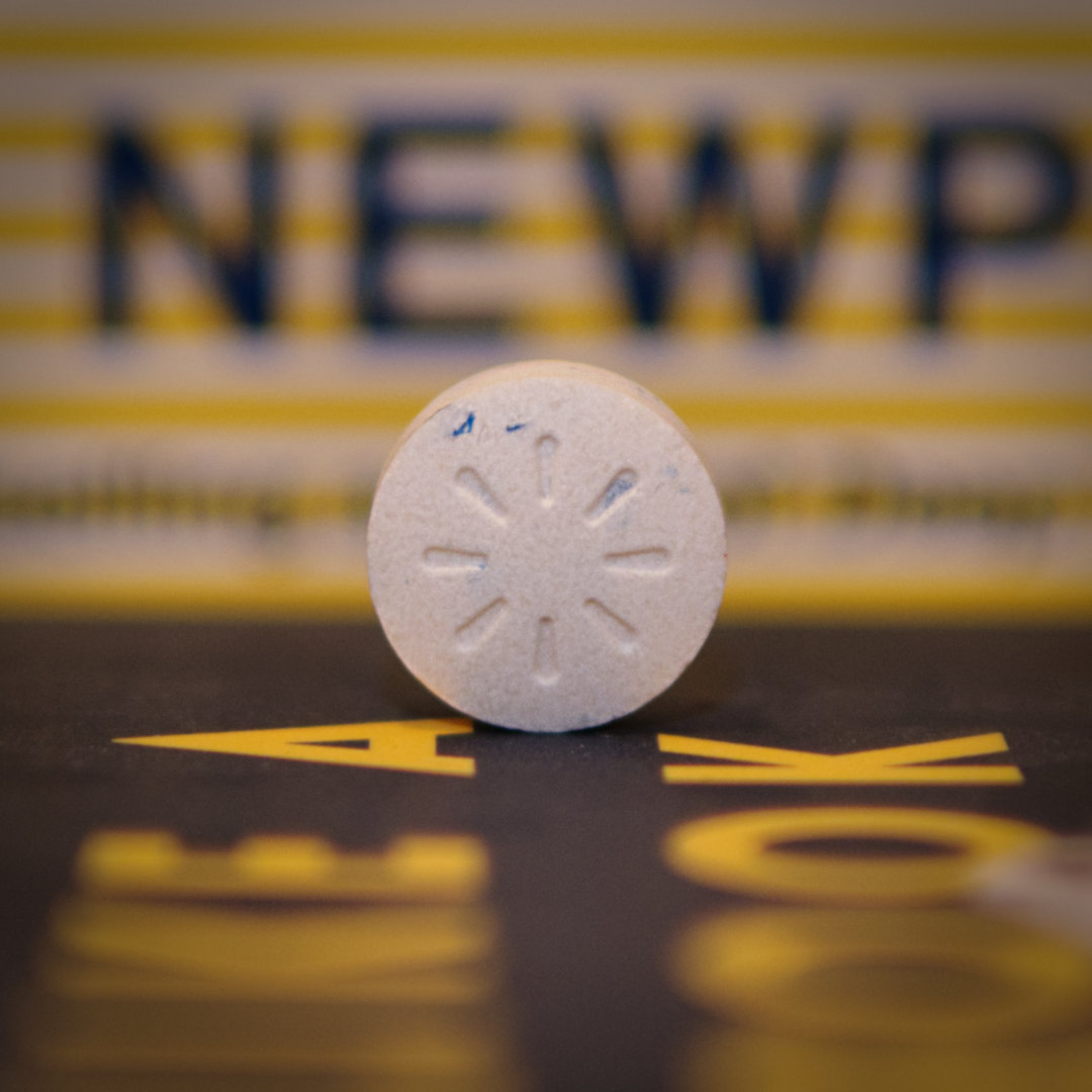 white caffeinated mint tablet